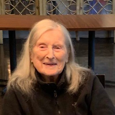 Smiling elderly woman in a common area