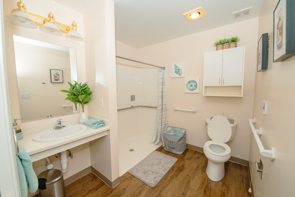Bright and clean bathroom in assisted living facility.