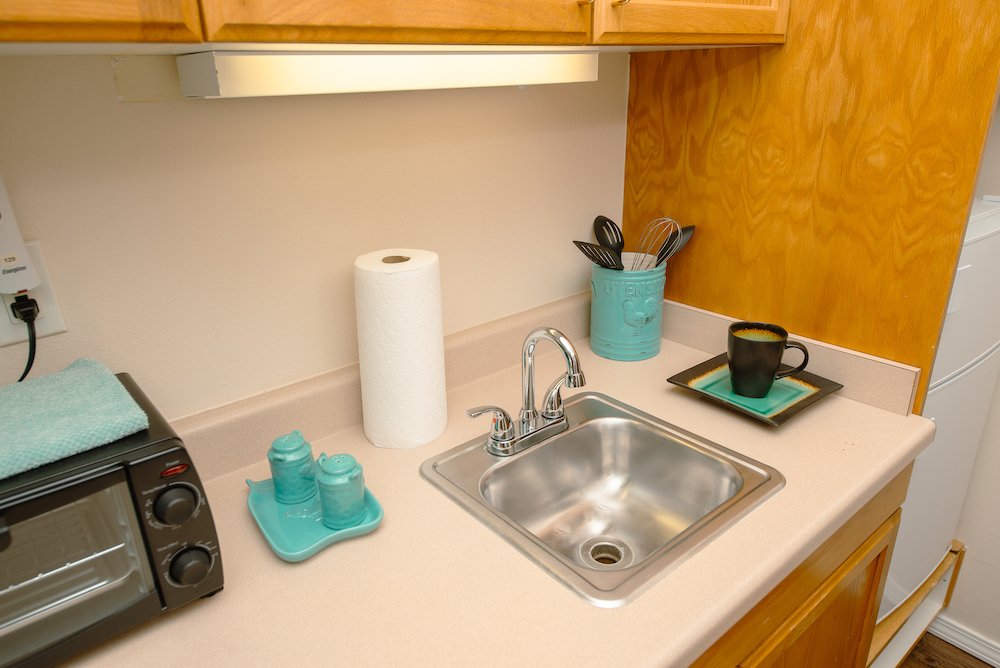 Cozy kitchenette with sink and coffee