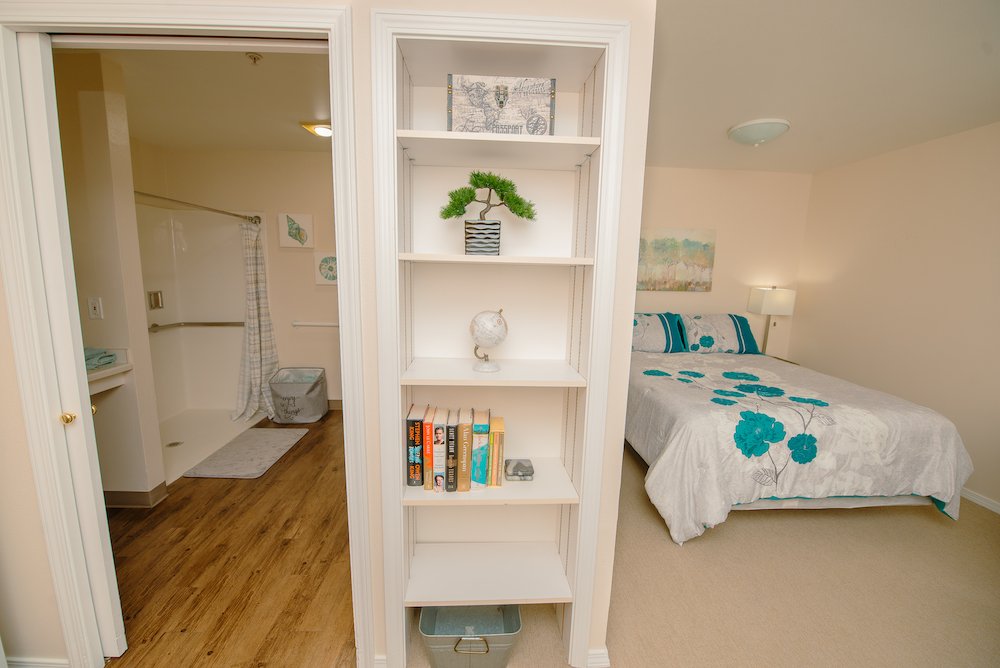 Cozy resident bedroom with bathroom and décor