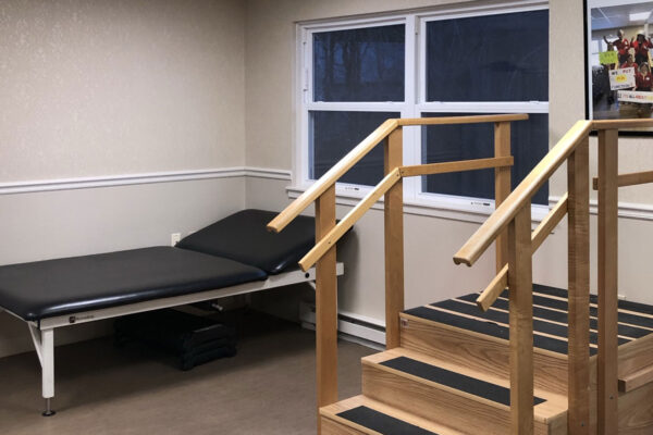Rehabilitation room with stairs and treatment table