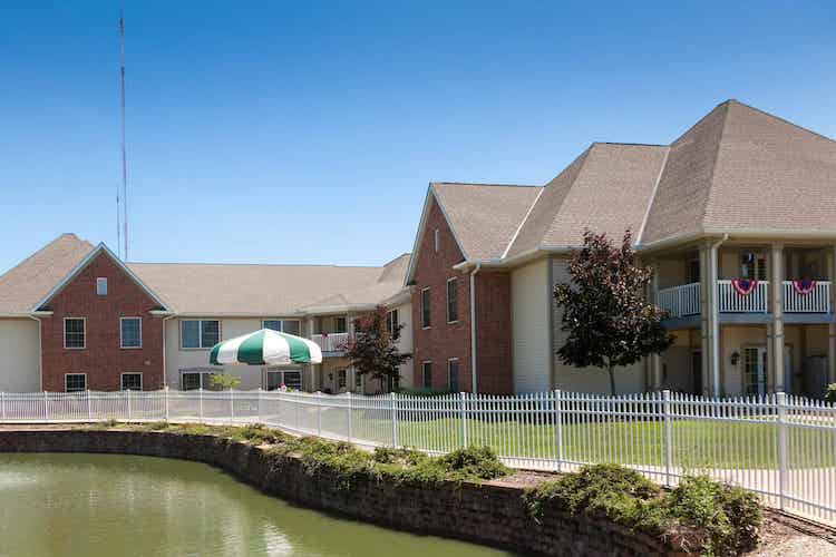 Exterior view of Mount Alverna Village with landscaping.