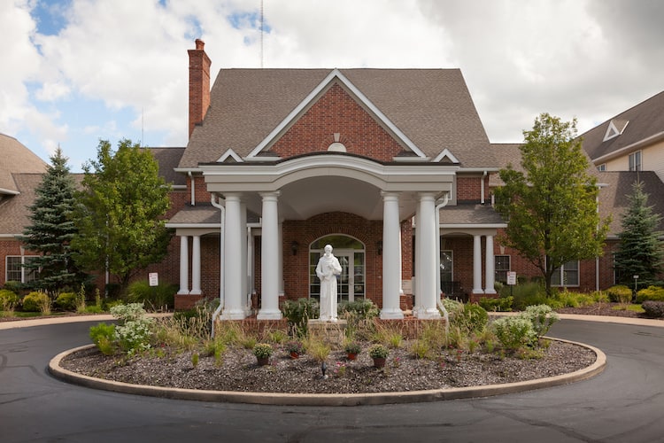 Exterior view of Mount Alverna Village with landscaping.