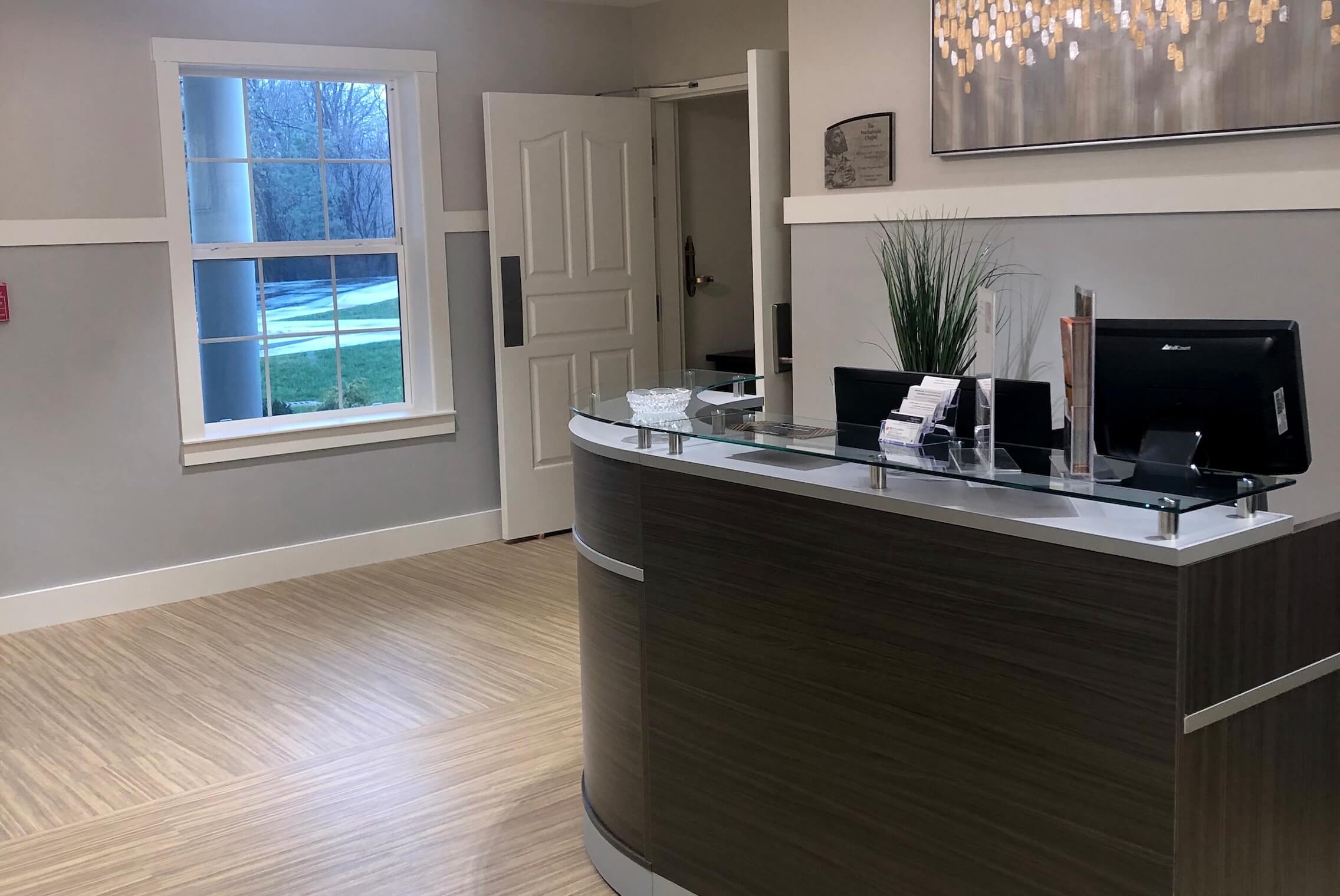 Reception area with modern decor and natural light.