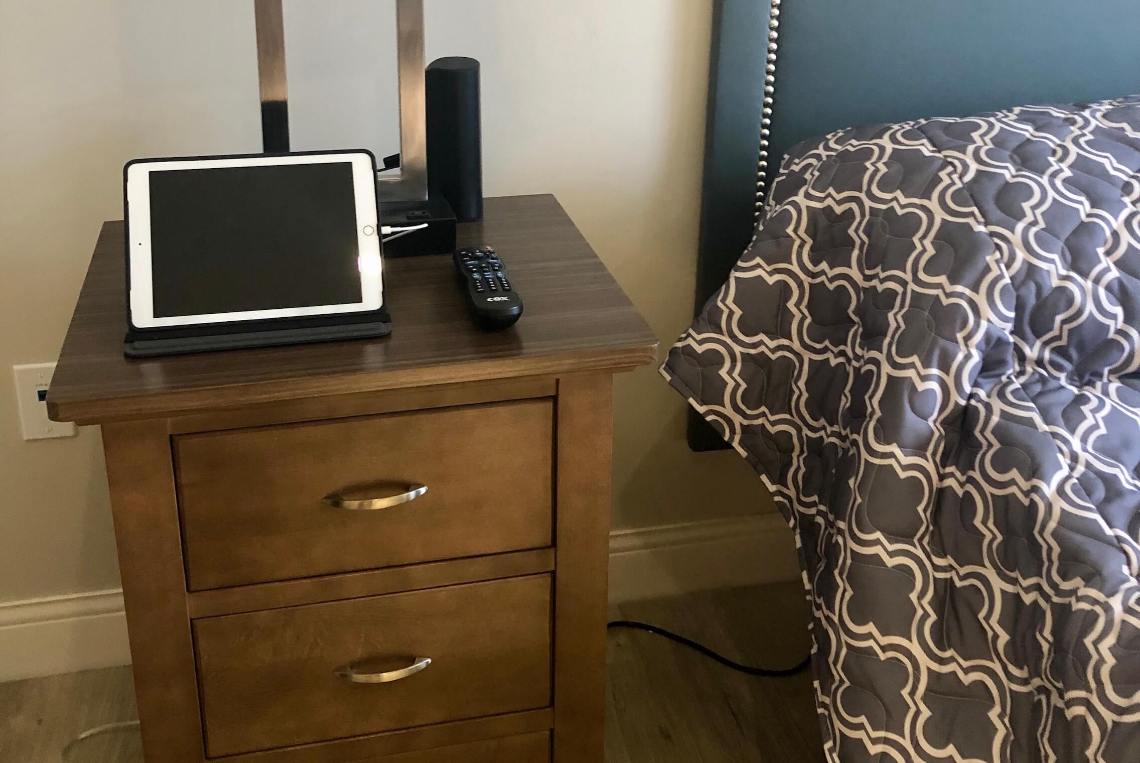 Cozy bedside setup with tablet and radio