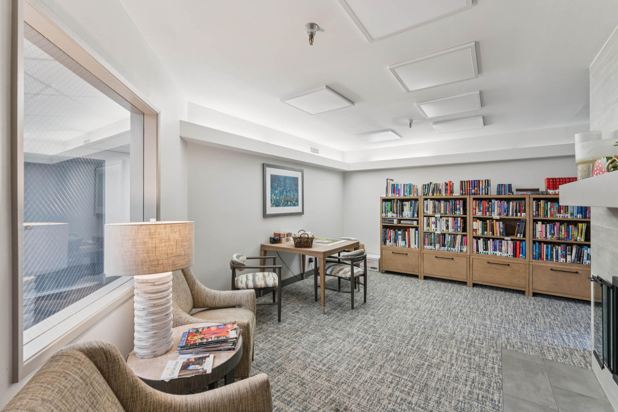 Cozy common area with bookshelves and seating