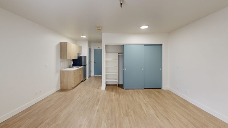 Bright, modern resident room with kitchenette.