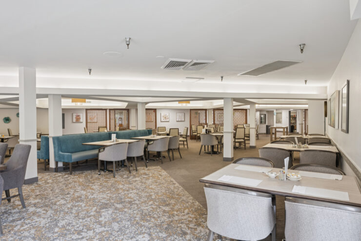 Interior view of the dining room with tables and seating.
