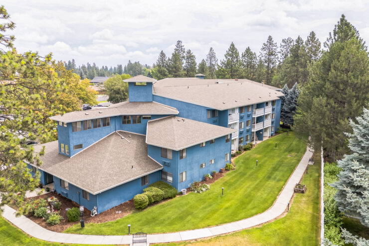 Aerial view of the assisted living facility with landscaped grounds.