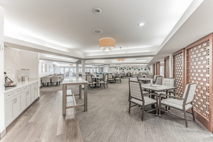Bright and inviting dining area with tables and chairs.
