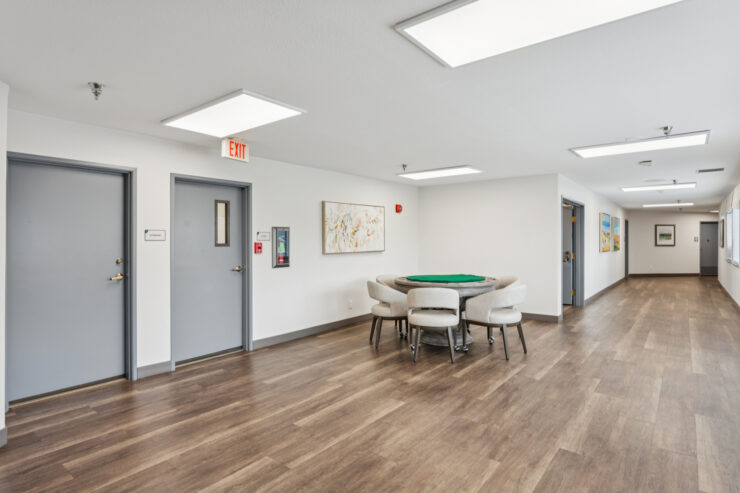 Bright and spacious corridor with seating area.