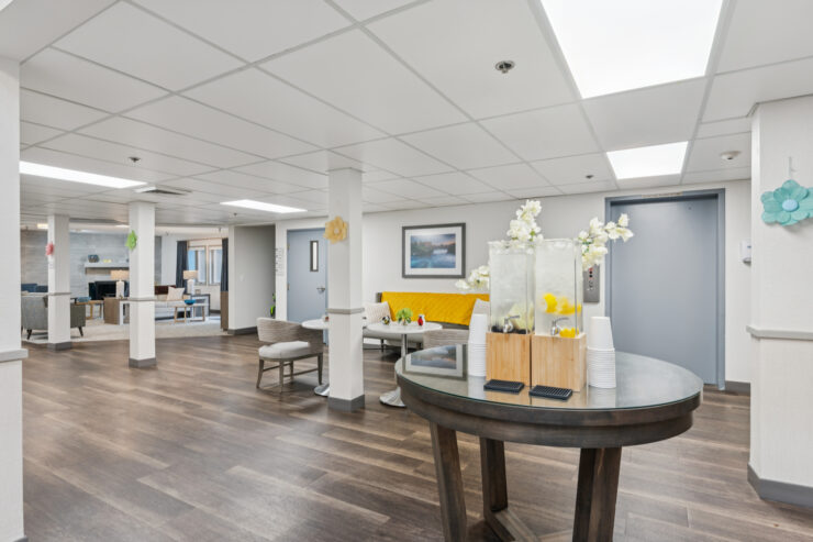 Bright common area with seating and decorations.