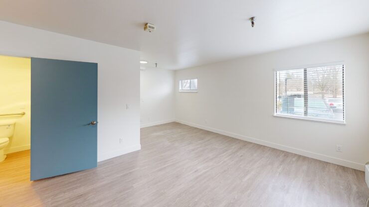 Bright, spacious resident room with a window.
