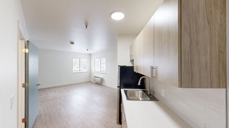Spacious interior of a resident room with kitchen