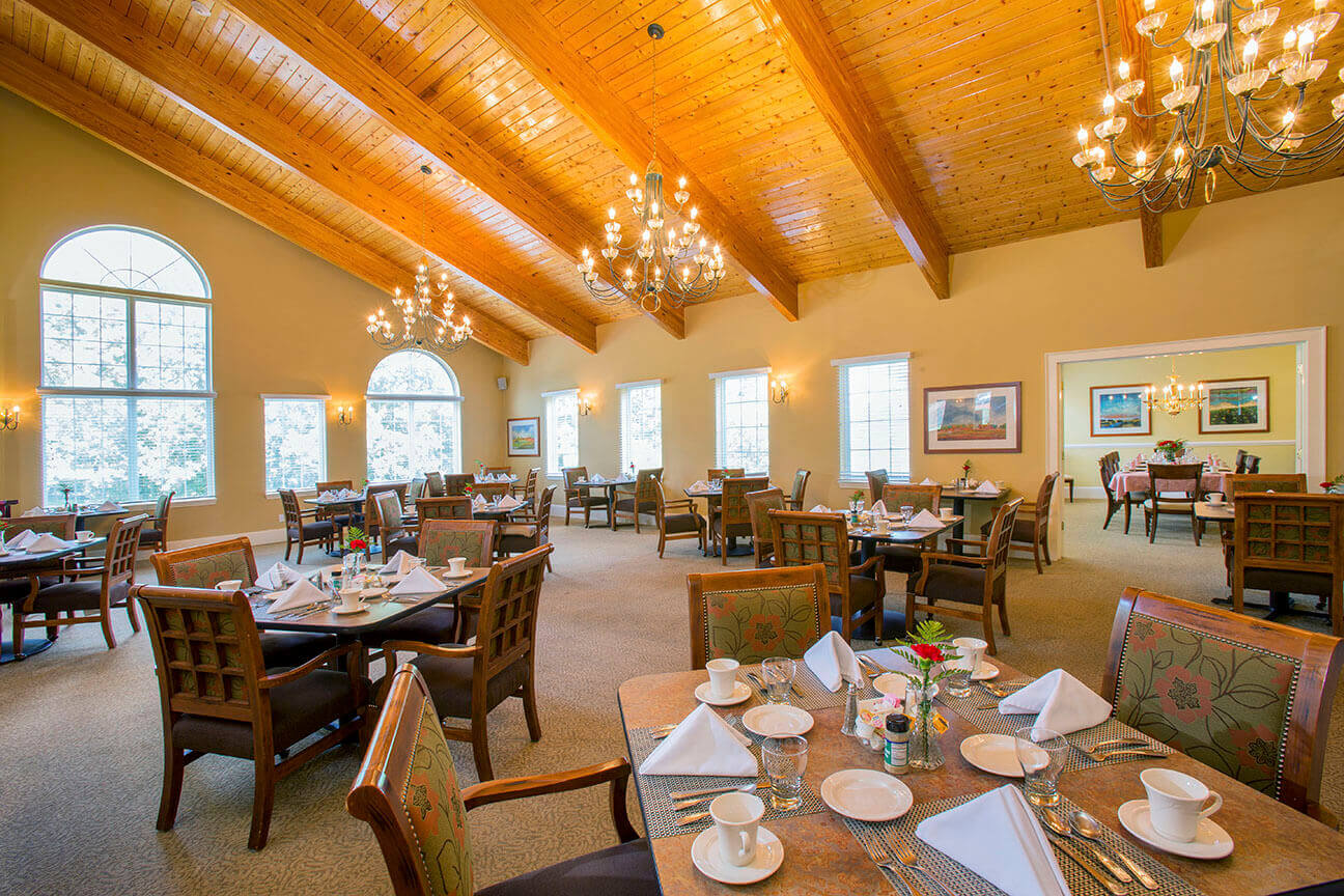 Dining area with tables set for meals.