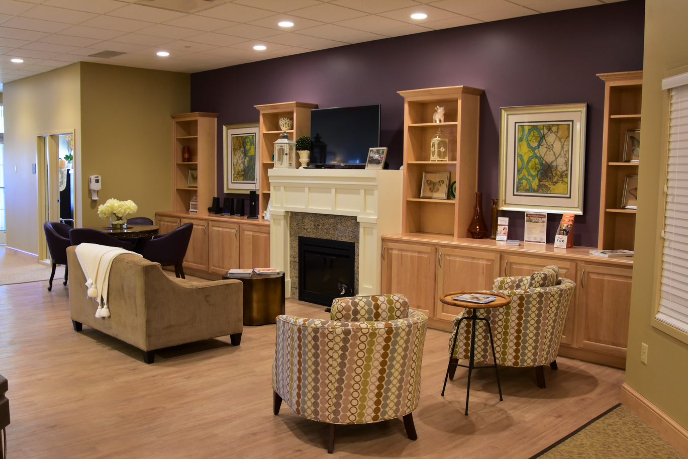 Cozy common area with seating and fireplace.