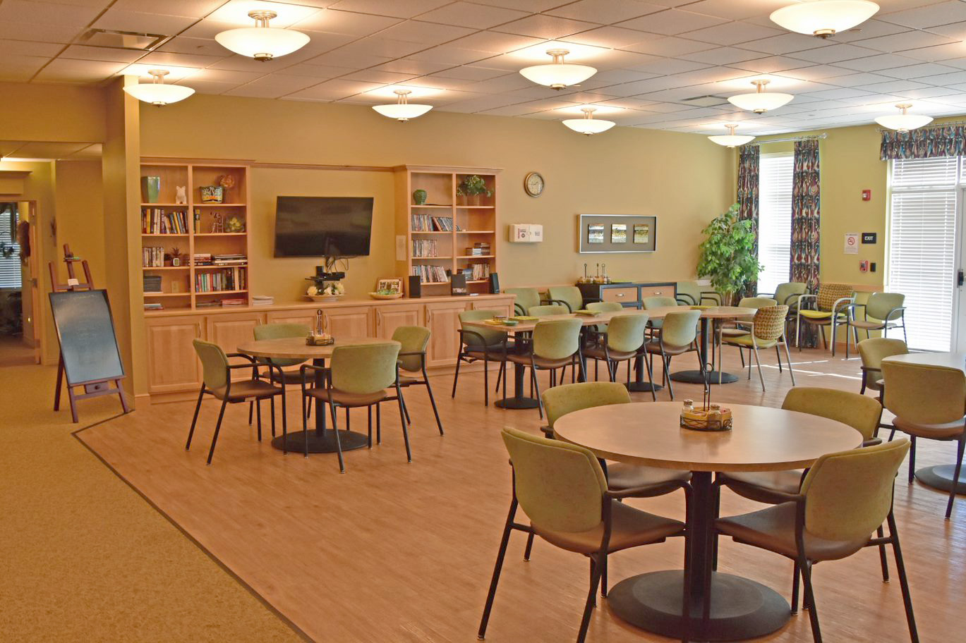 Common dining area with tables and chairs.