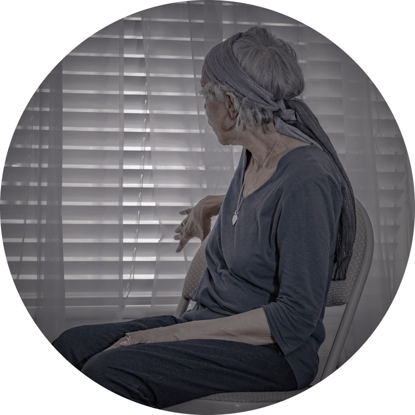 Senior woman seated near window