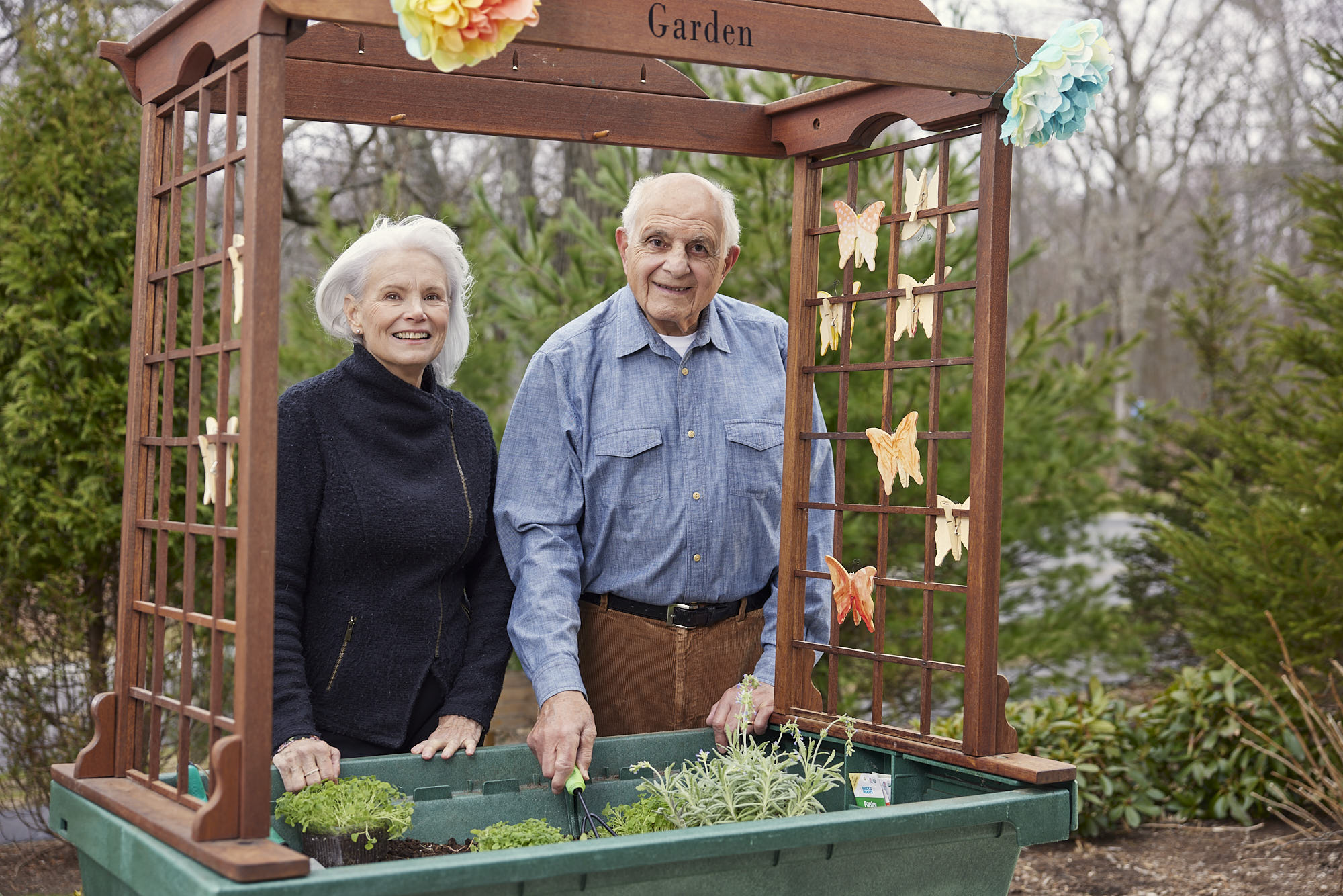 Two residents gardening in an outdoor space