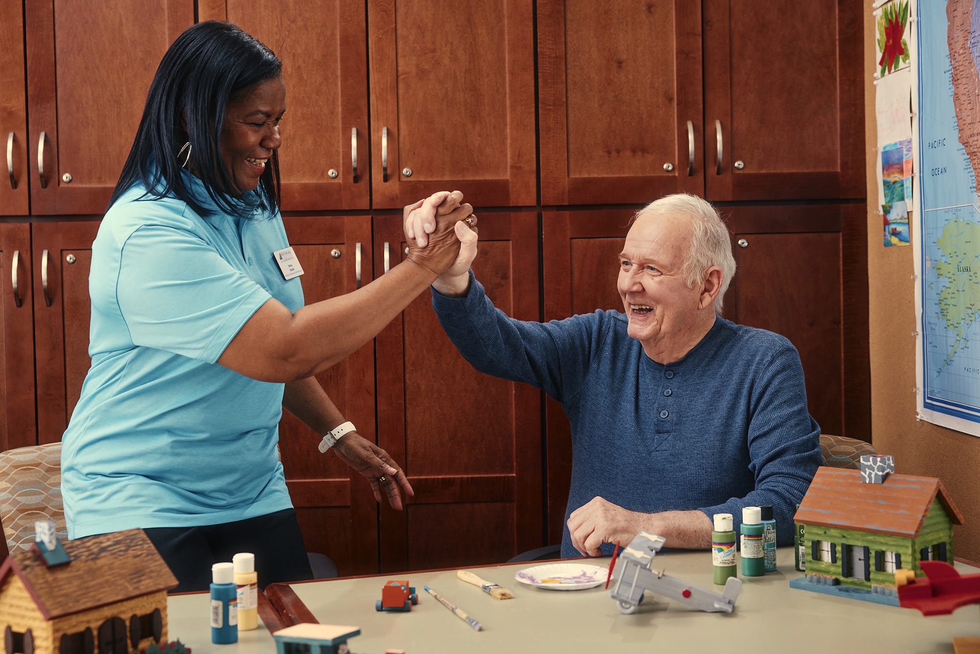 Staff and resident engaging in an activity