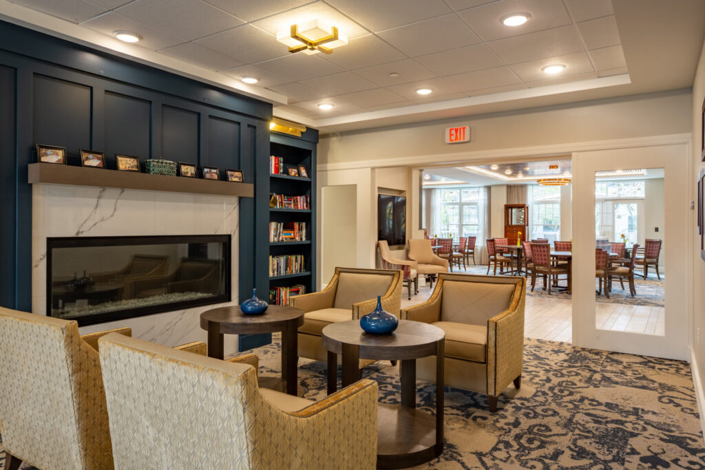 Well-designed common area with seating and a fireplace.