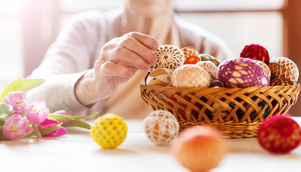 Resident engaging in a crafting activity with colorful balls.
