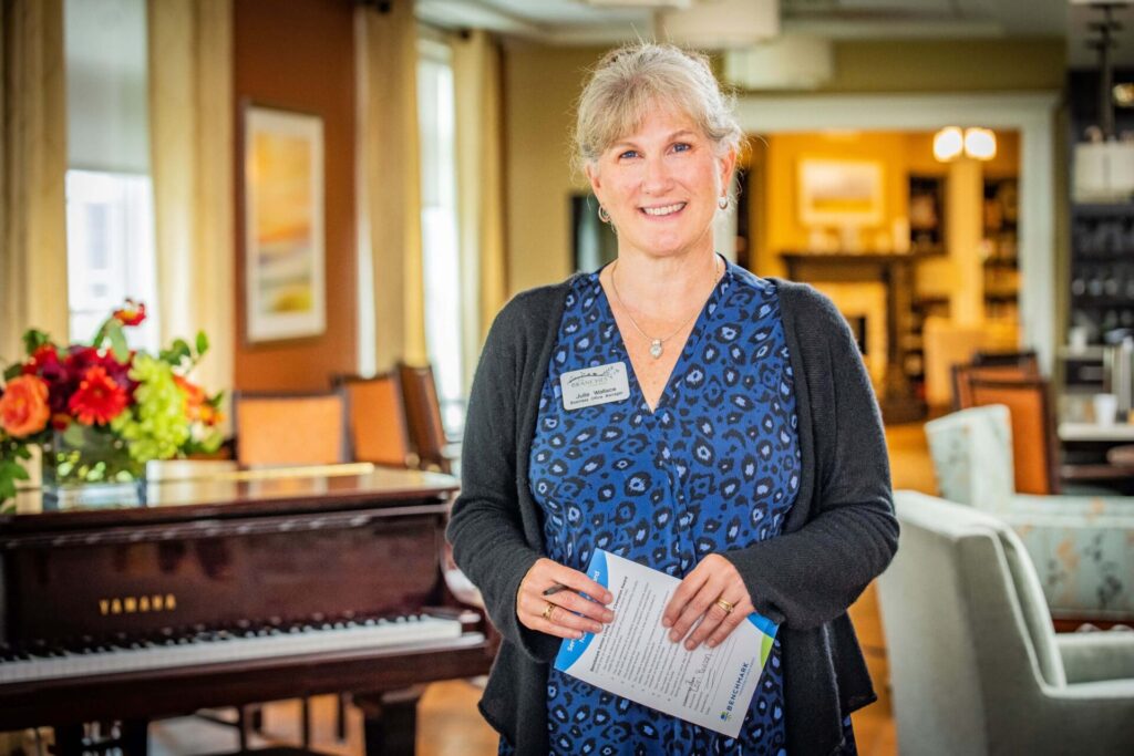 Staff member smiling in a common area