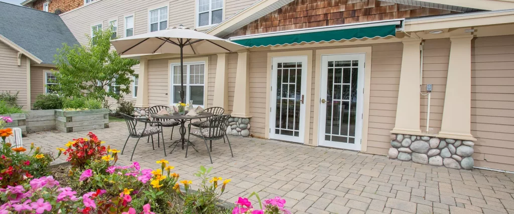 Patio area with flowers and outdoor seating