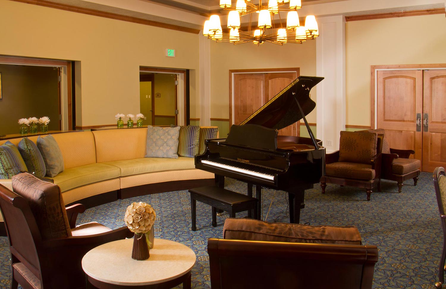 Cozy common area with a piano and seating