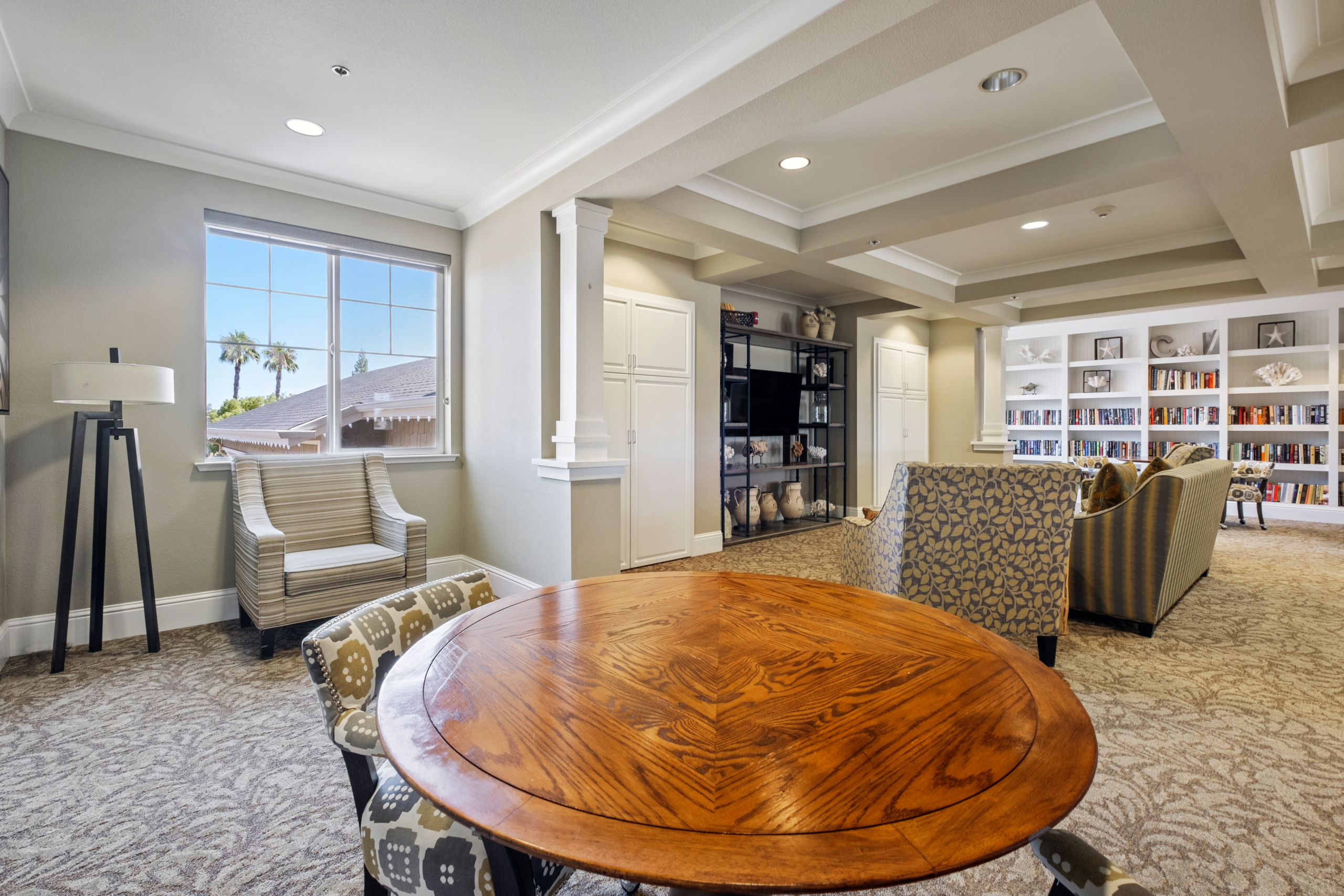 Common area with seating and bookshelves