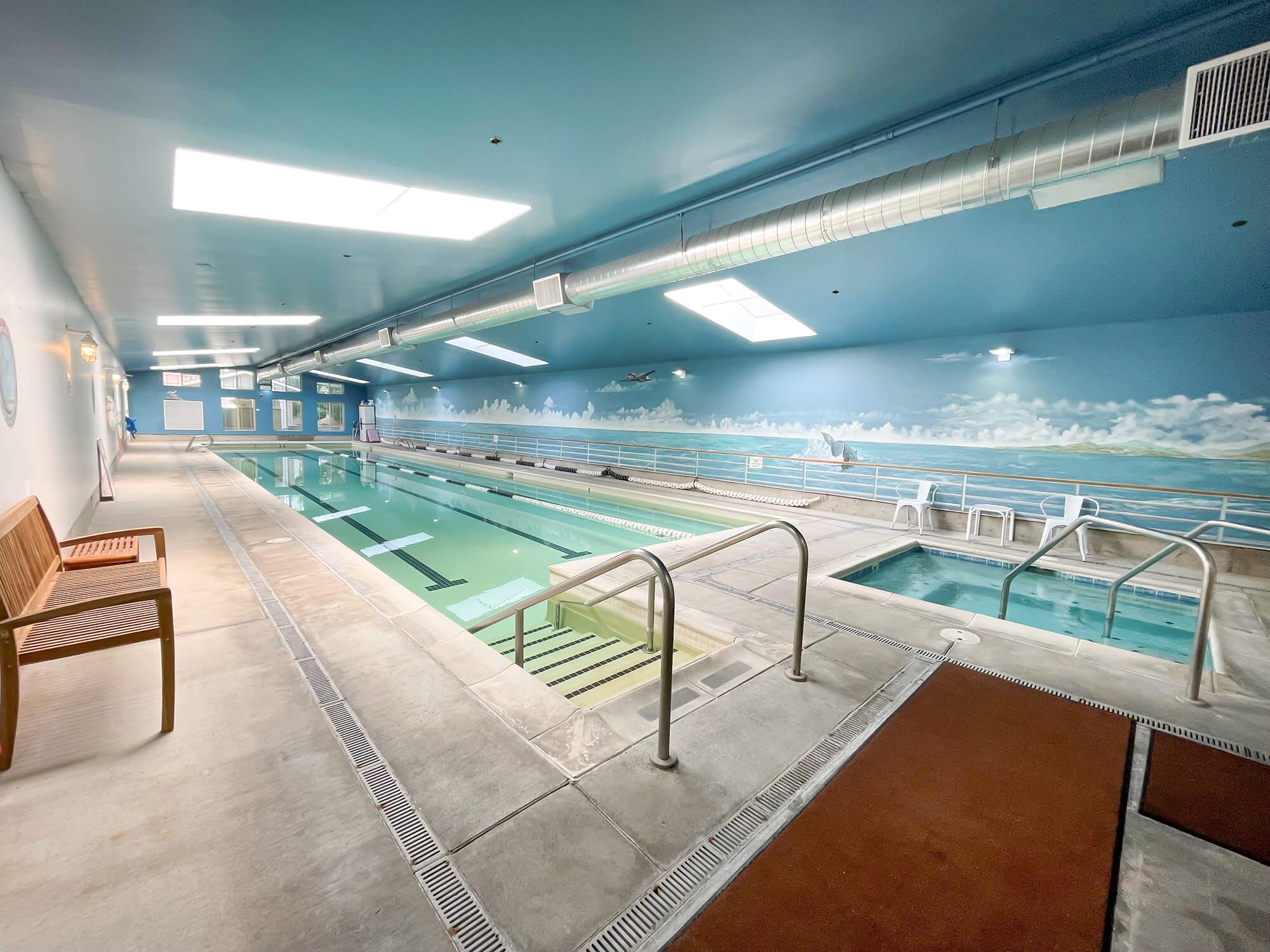 Indoor swimming pool area with relaxing decor
