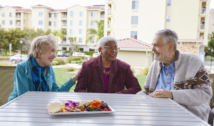 Three seniors enjoying time together outdoors