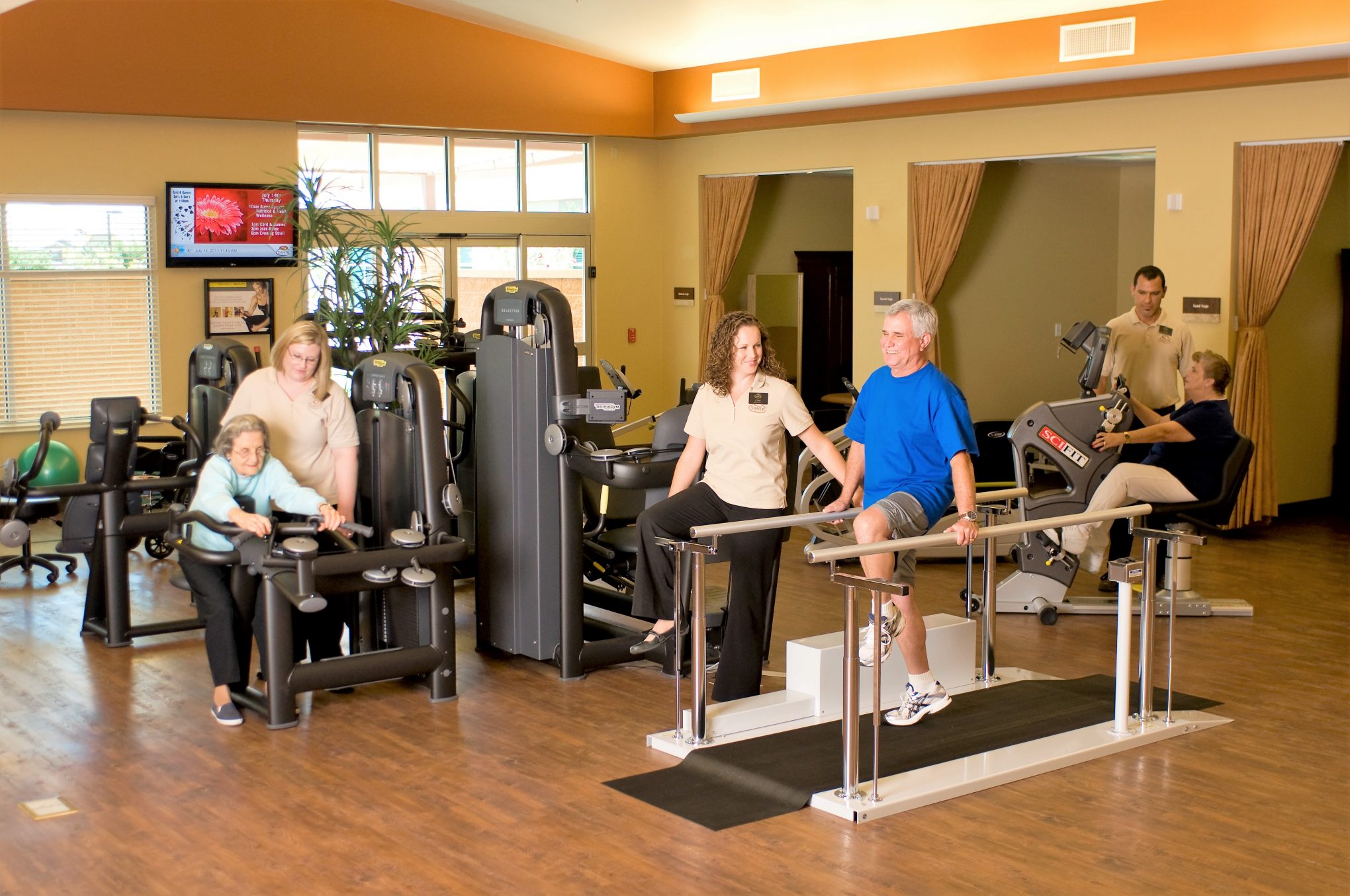 Residents engaging in fitness activities with staff
