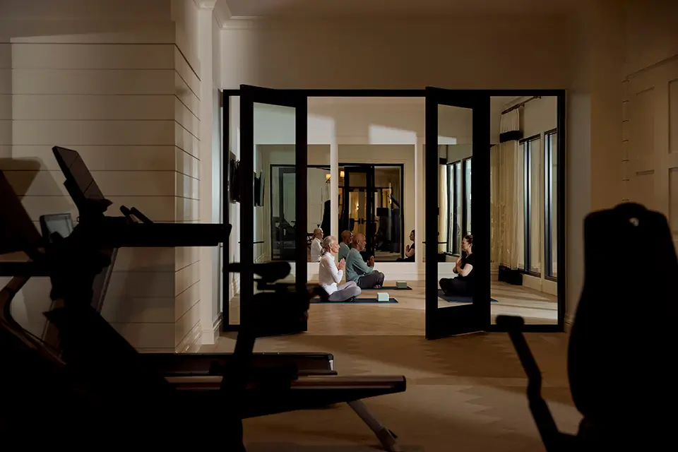Residents participating in a yoga class indoors.