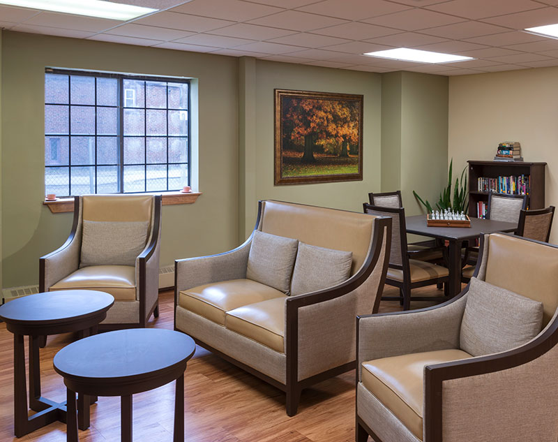 Cozy common area with seating and chess table.