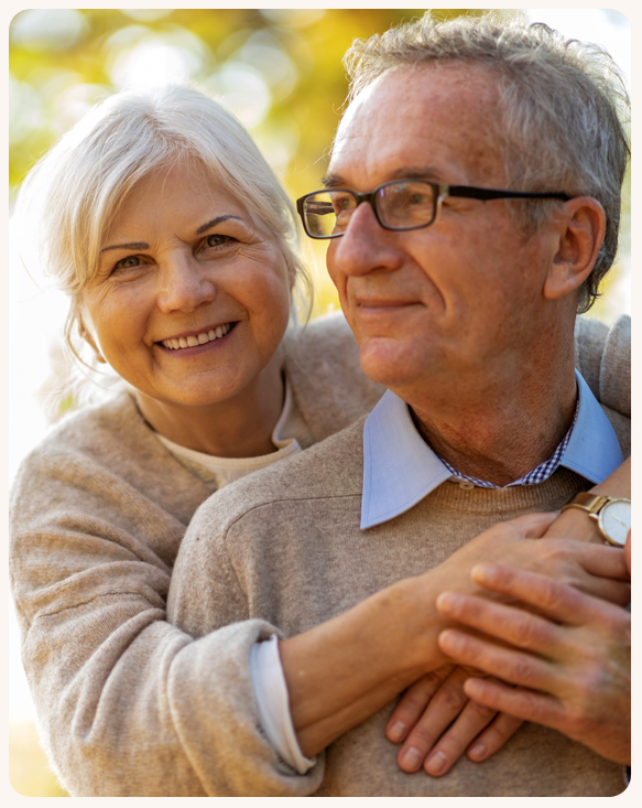 Elderly couple enjoying time together outdoors.