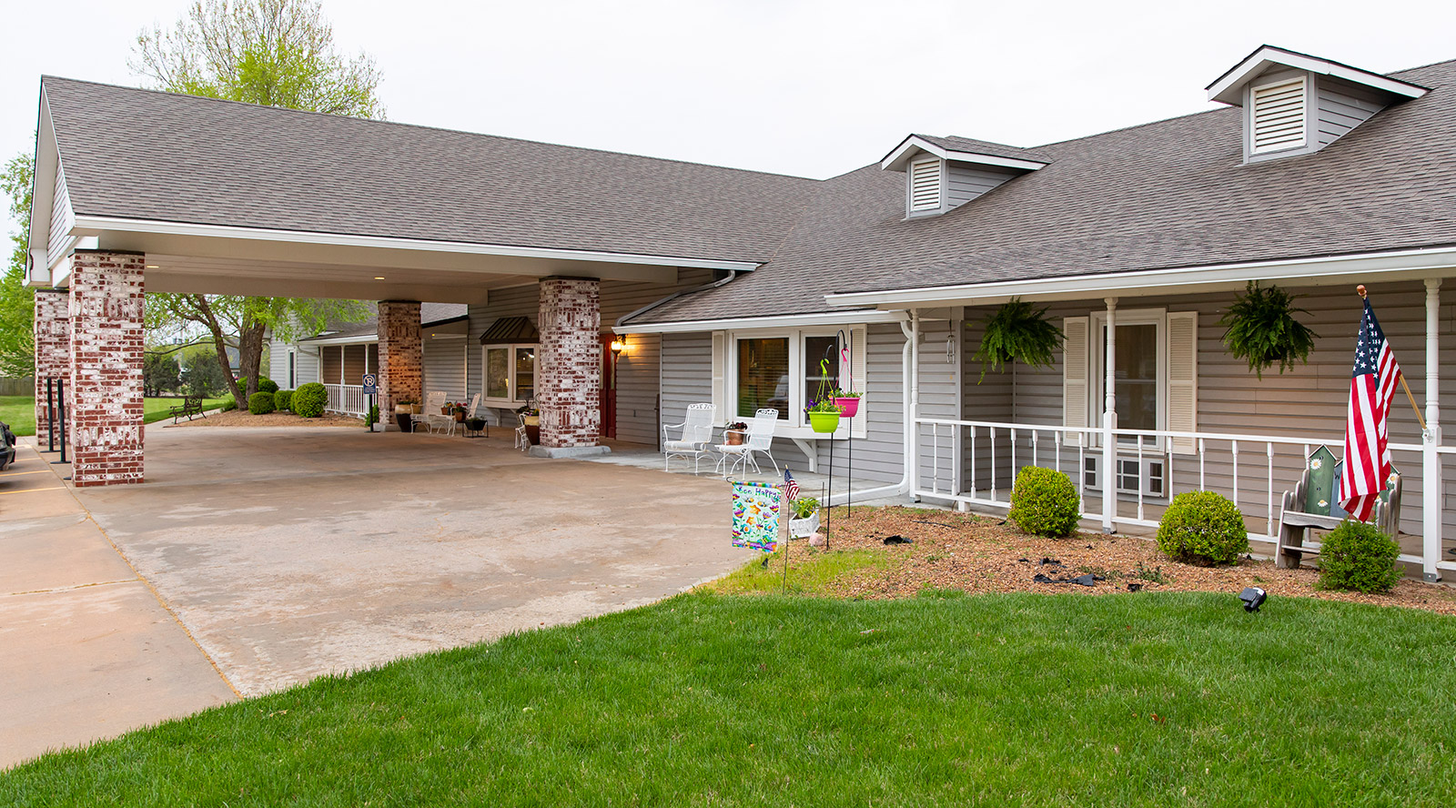 Exterior view of the assisted living facility with garden