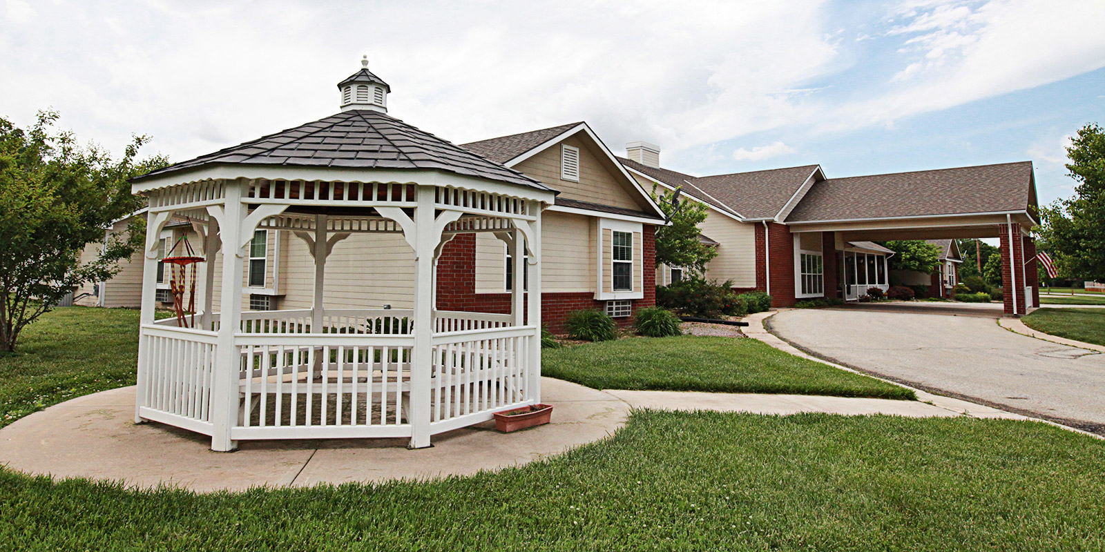 Exterior view of a facility with gazebo and landscaping.