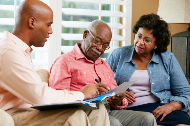 Residents and staff engaged in conversation.