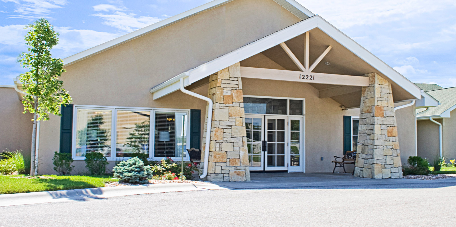 Exterior view of Homestead Estates building entrance.