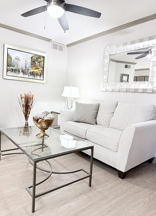 Cozy living room featuring a sofa and artwork.
