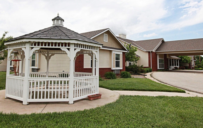 Outdoor gazebo with grassy area nearby