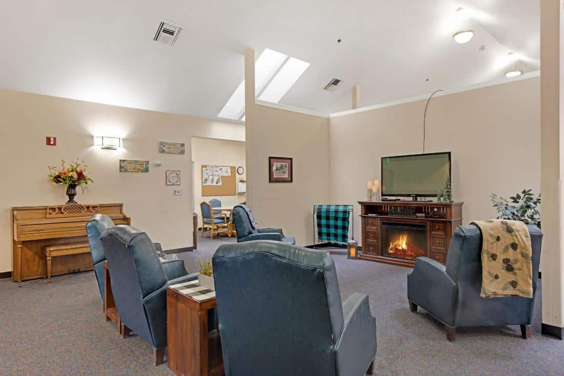 Cozy common area with seating and a piano