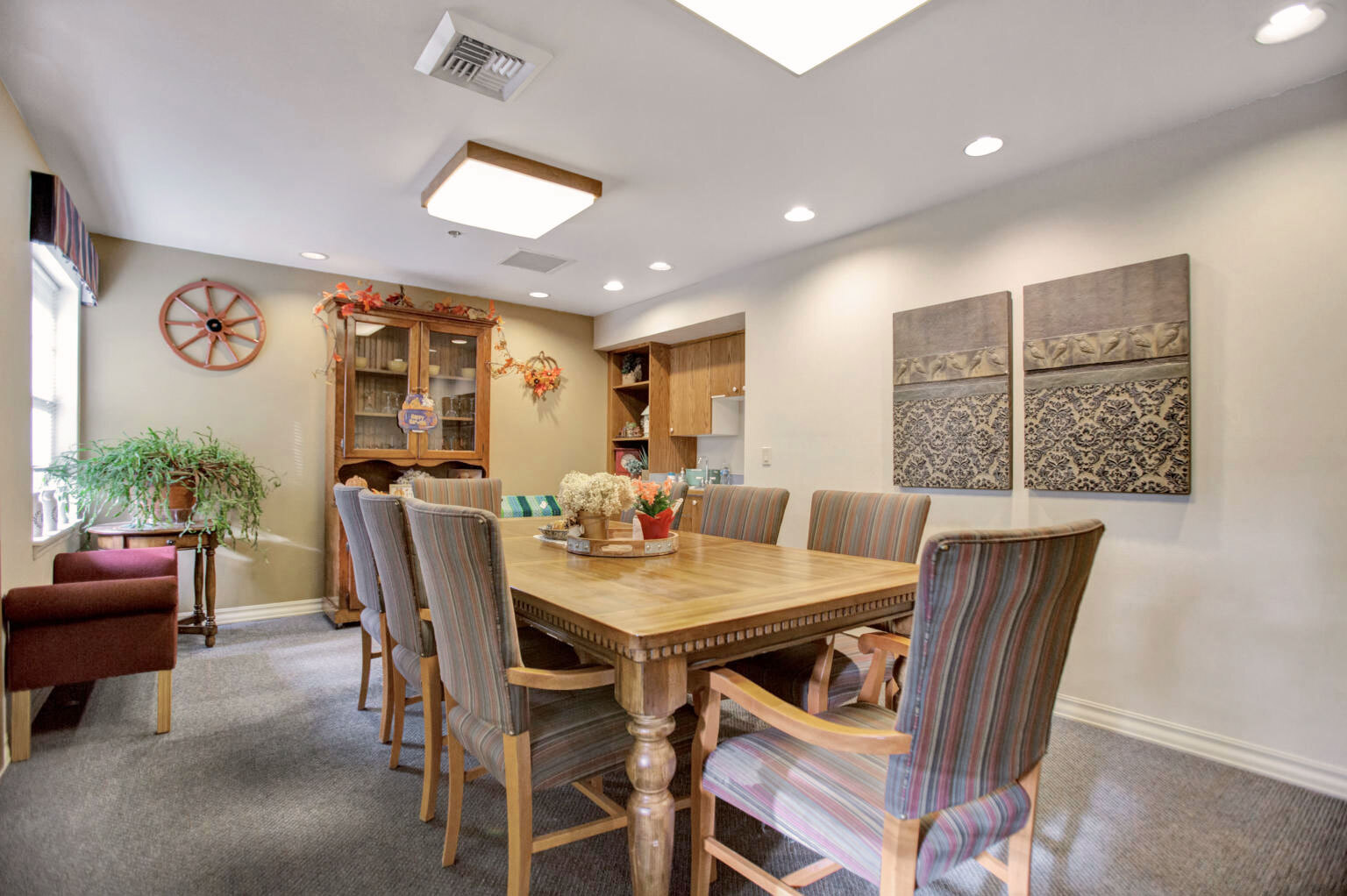Common area with a large dining table and chairs