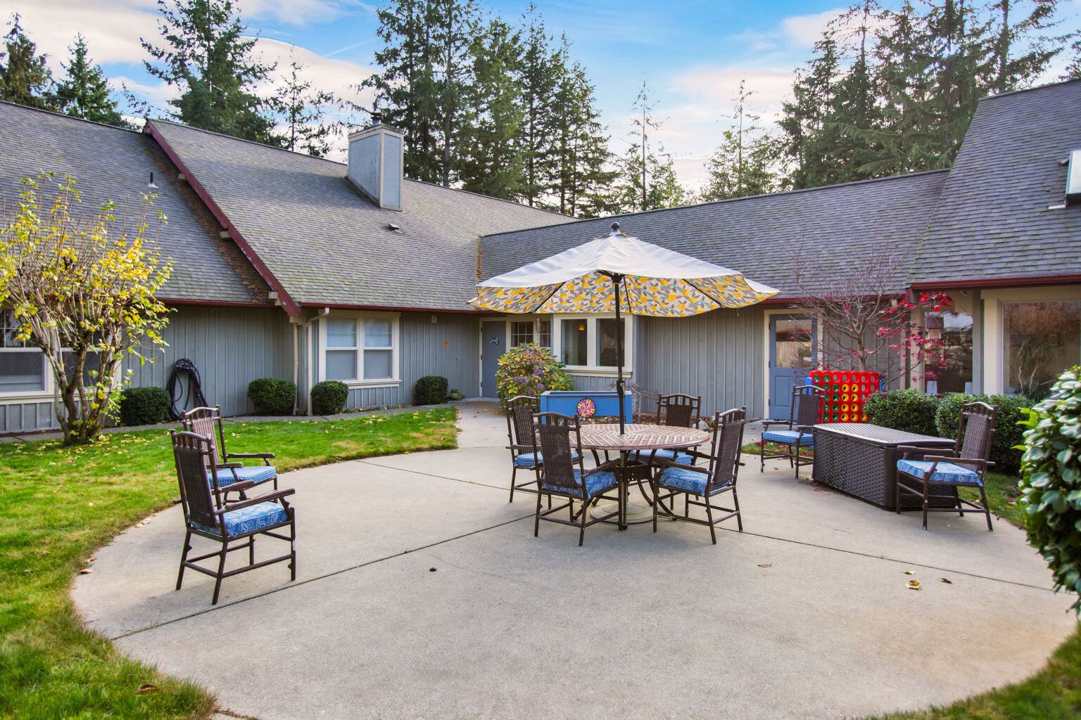 Outdoor patio with seating and an umbrella
