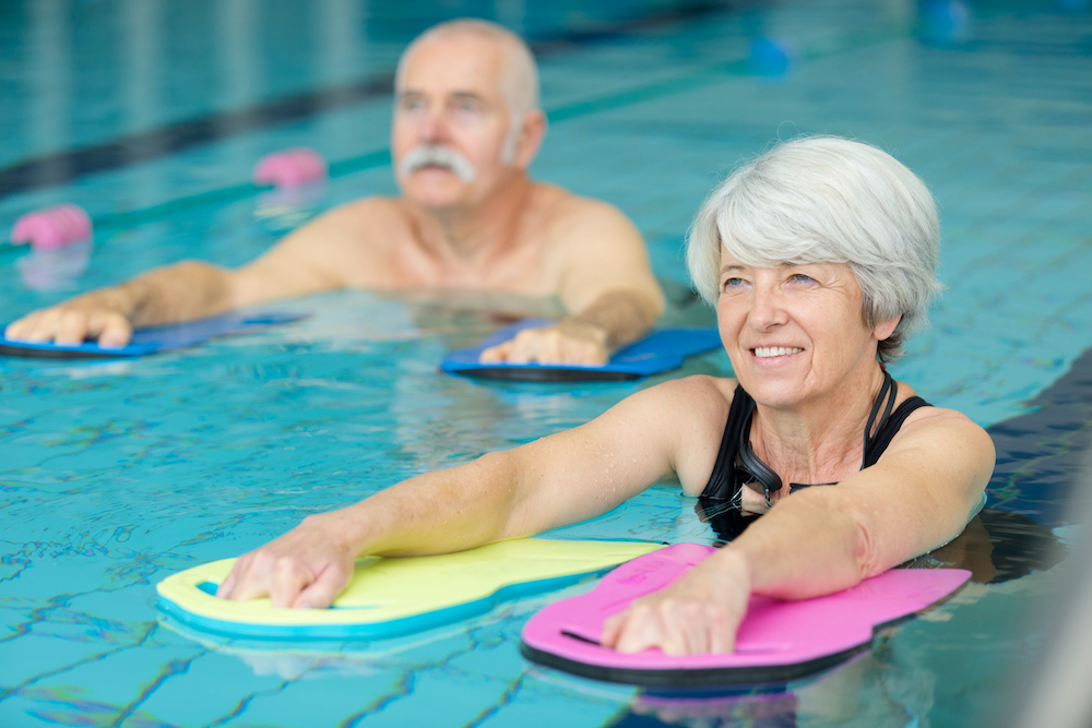 Seniors participating in a water exercise class.