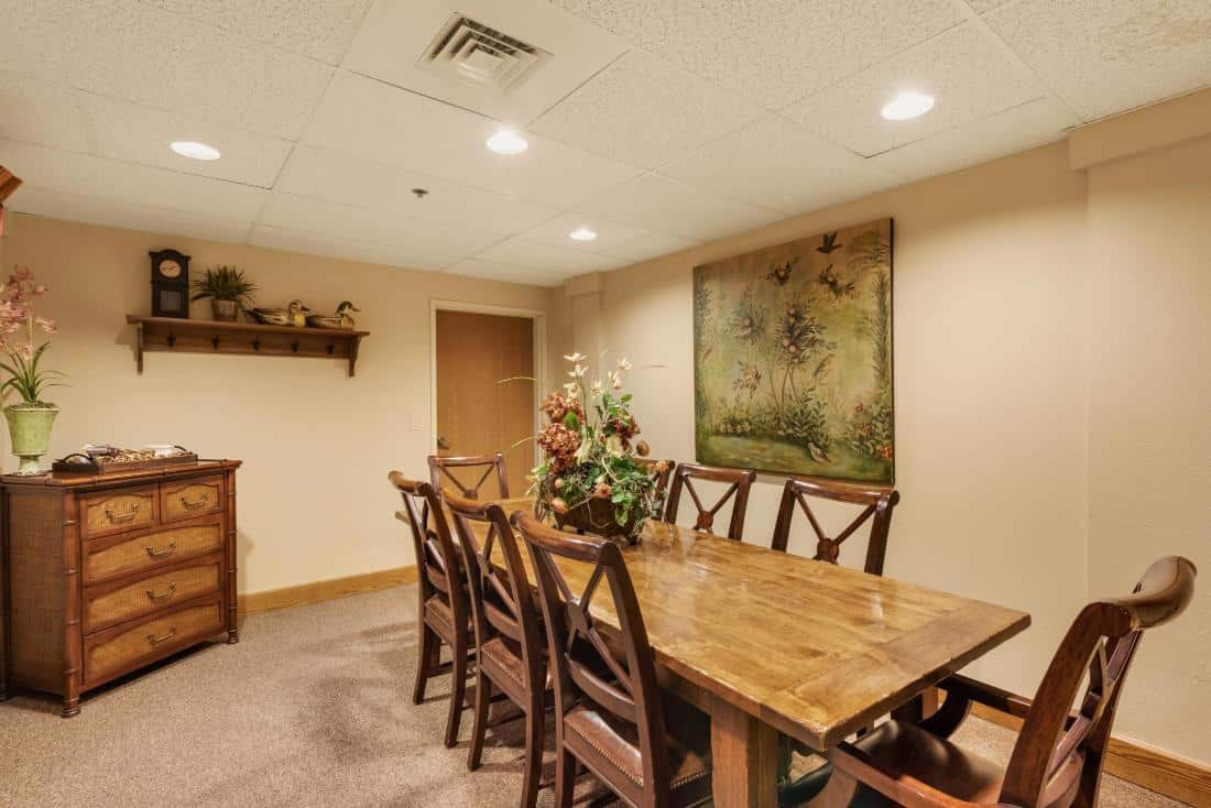 Cozy common area with a dining table and artwork.