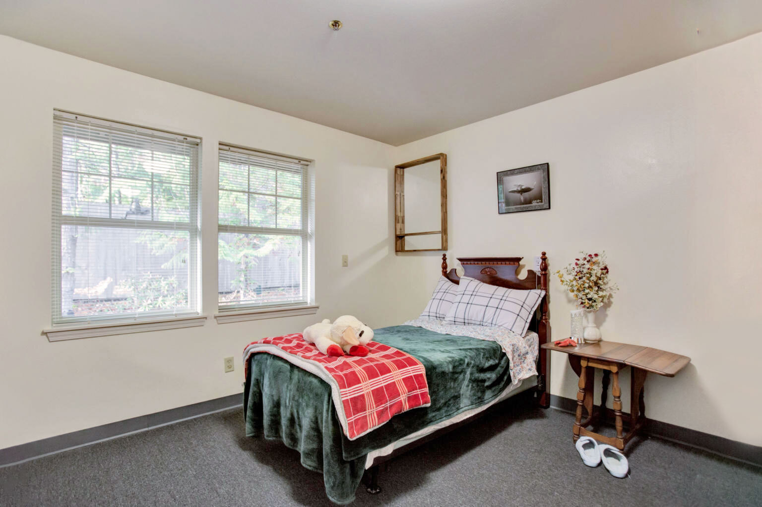 Cozy resident room with a bed and decor.