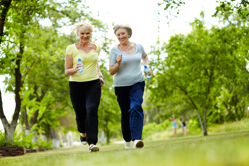 Two women jogging in a park