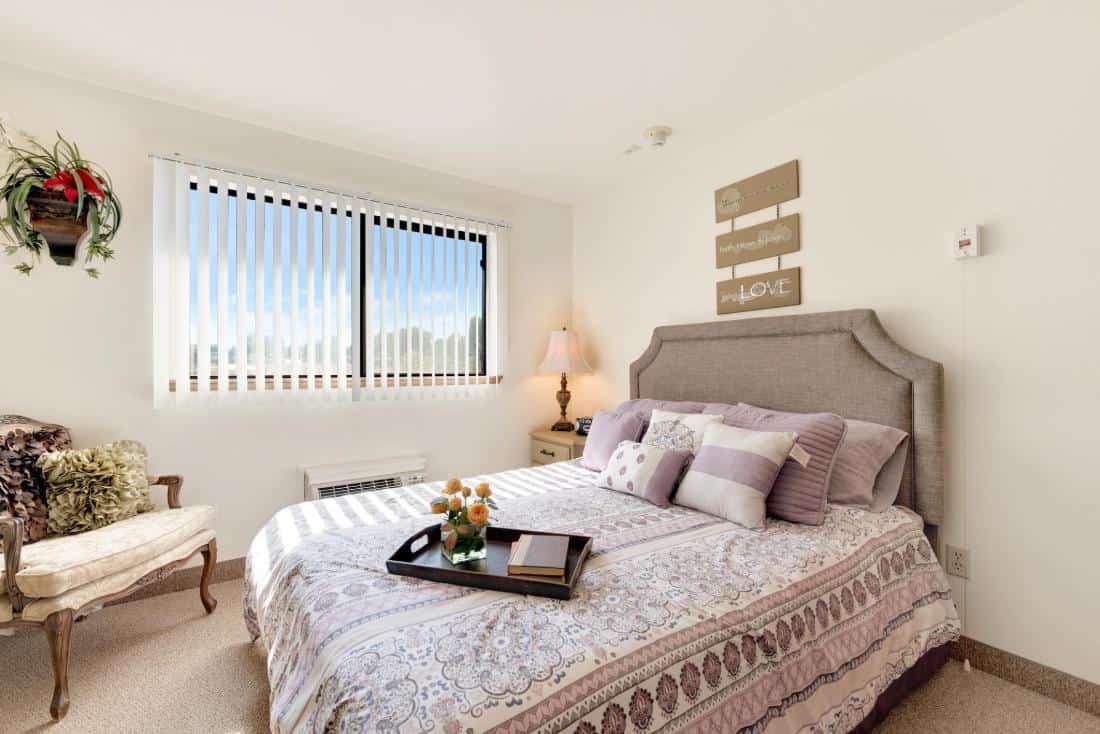 Well-decorated private bedroom with cozy furnishings.